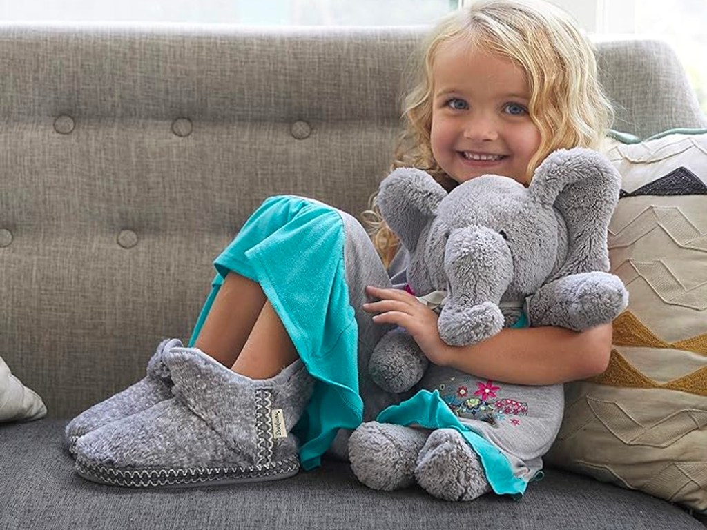 girl wearing gray slippers on couch