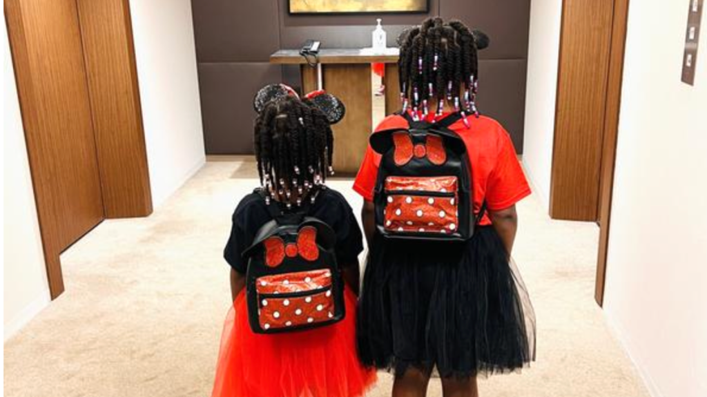 girls wearing Disney backpacks from Kohl's 