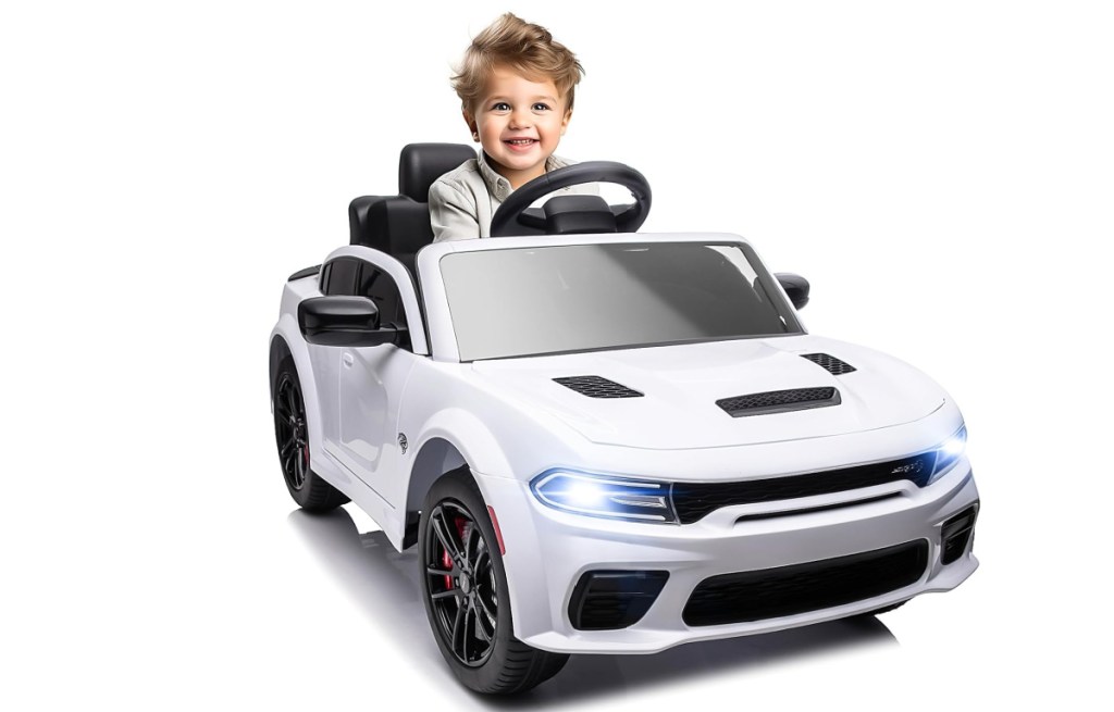 dodge ride on car in white with kiddo inside of it