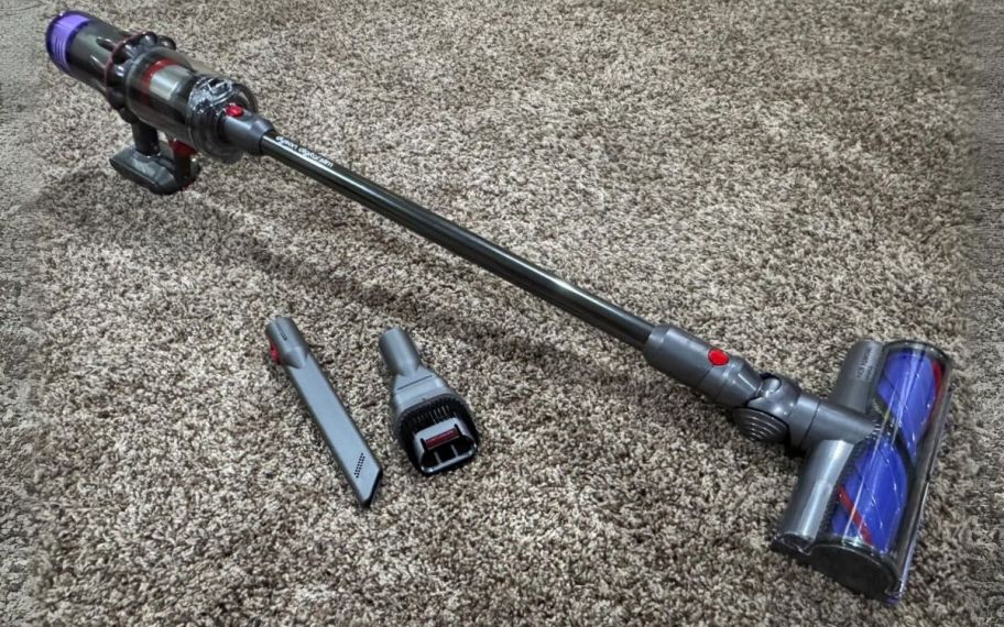 a dyson cordless vacuum shown with attachments