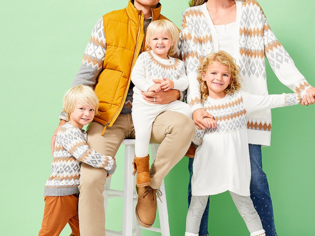 family wearing matching sweaters