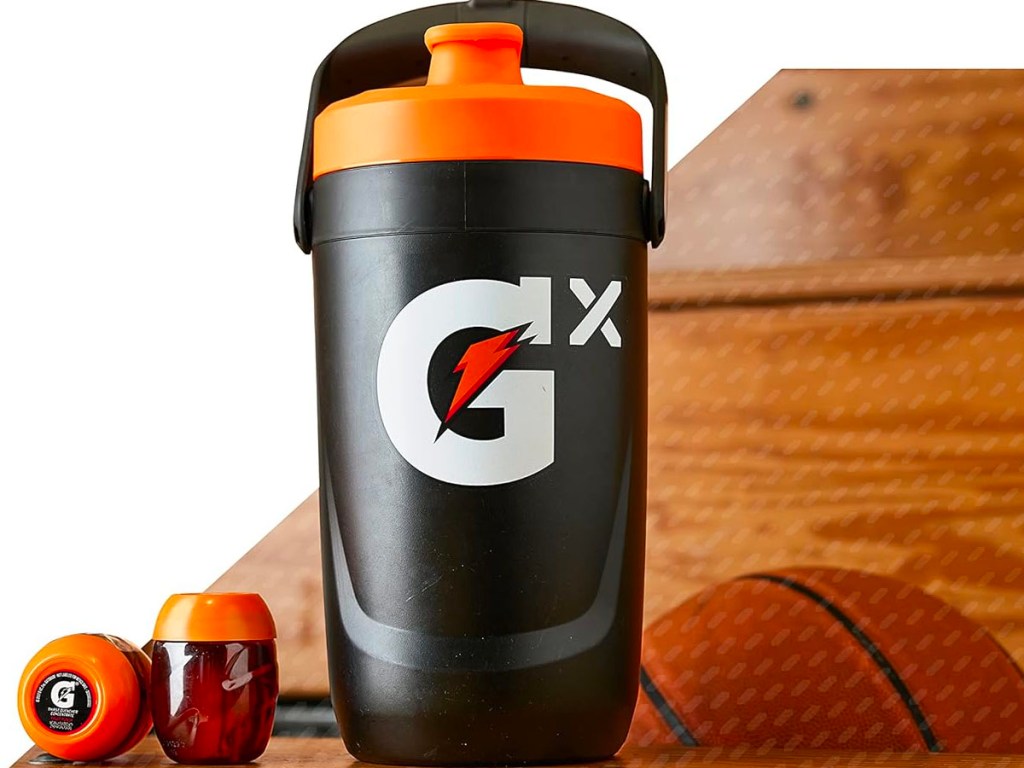 gatorade gx jug with pods next to basketball