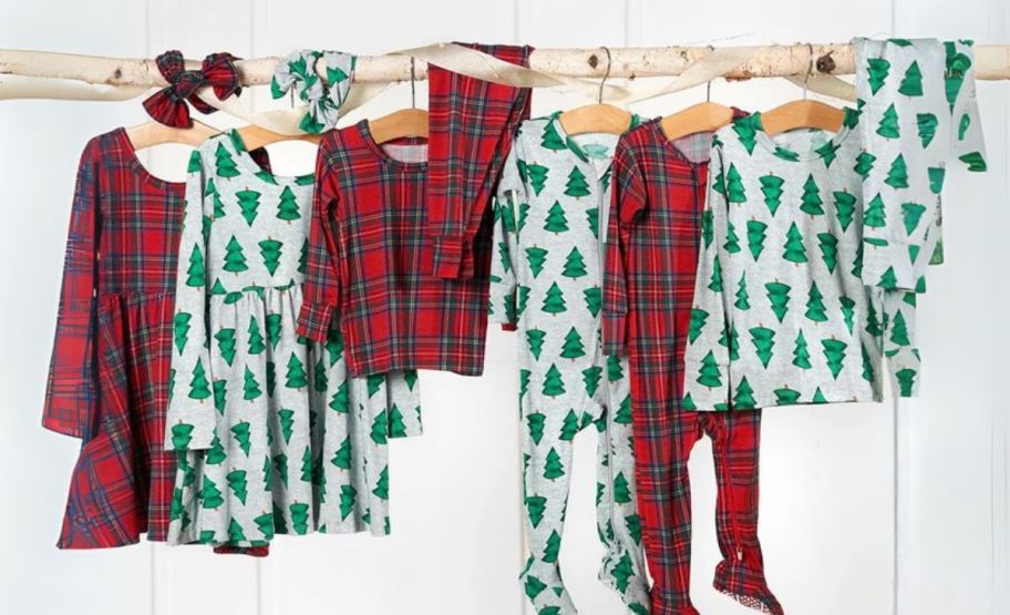 kids christmas pajamas hanging from a tree branch