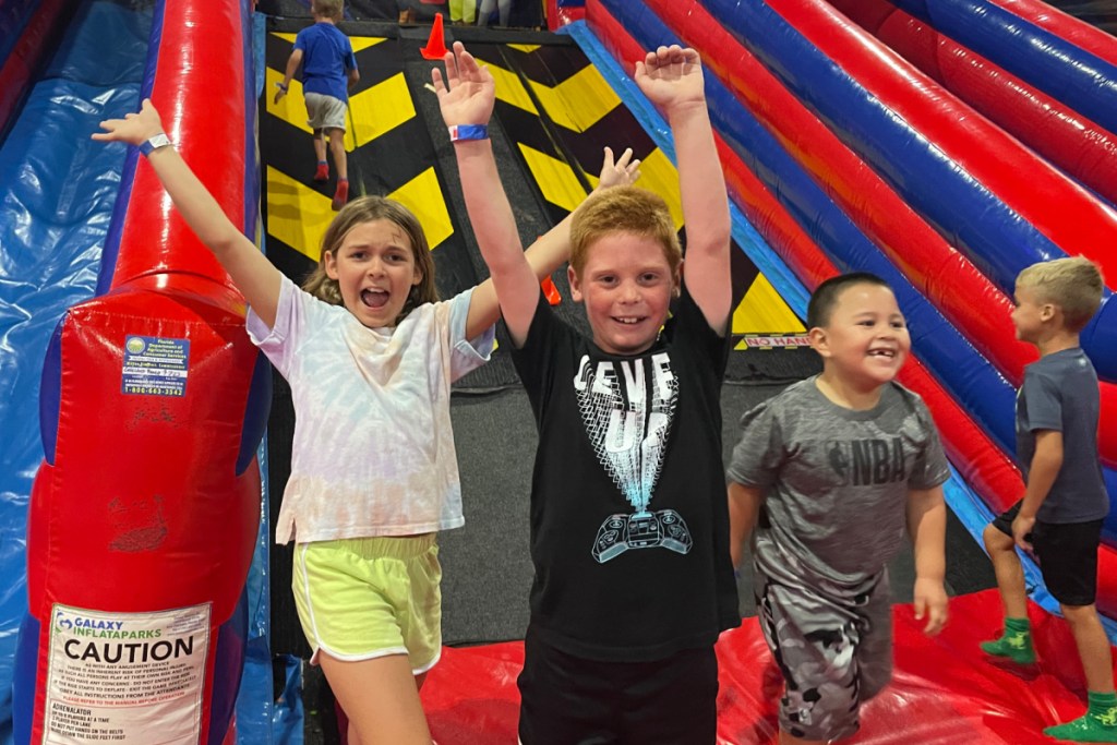 kids playing at a trampoline park