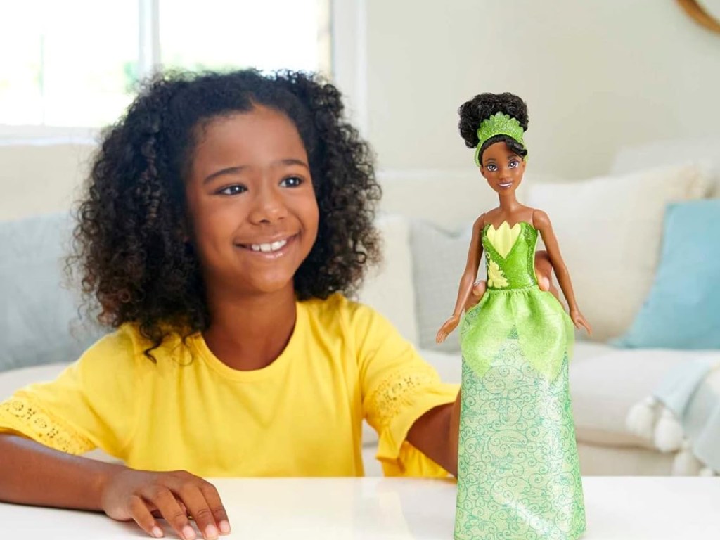 girl playing with Mattel Disney Princess Dolls - Tiana