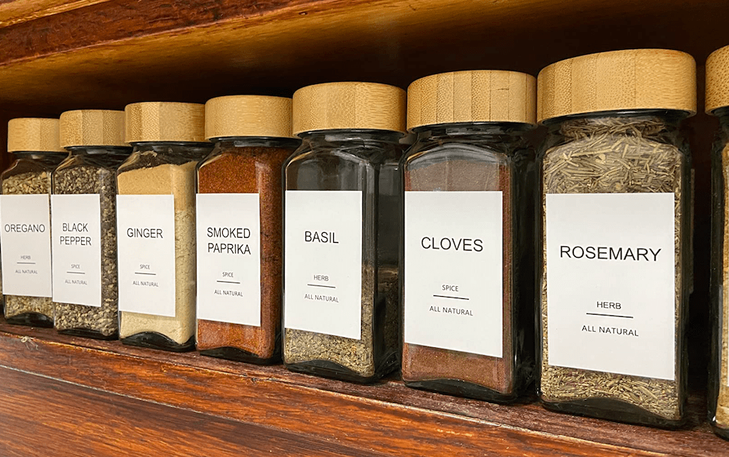 glass spice jars on shelf 