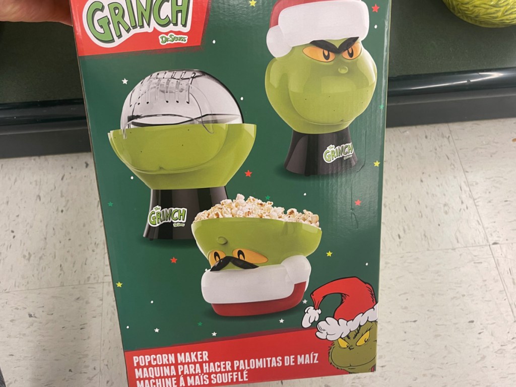 hand holding grinch popcorn maker from the store