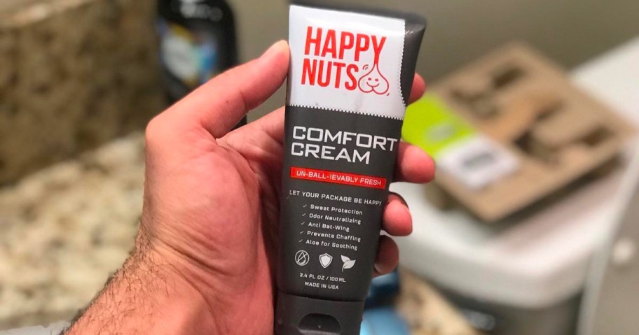 hand holding happy nuts comfort cream