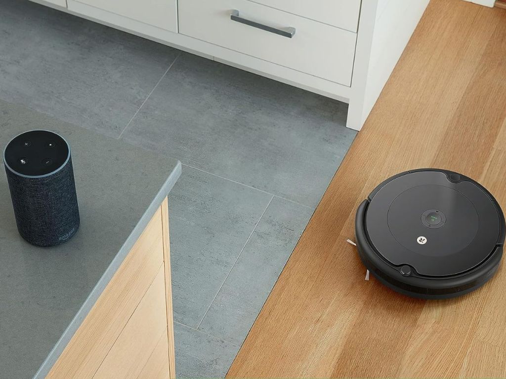 IRobot roomba near an Amazon Alexa device