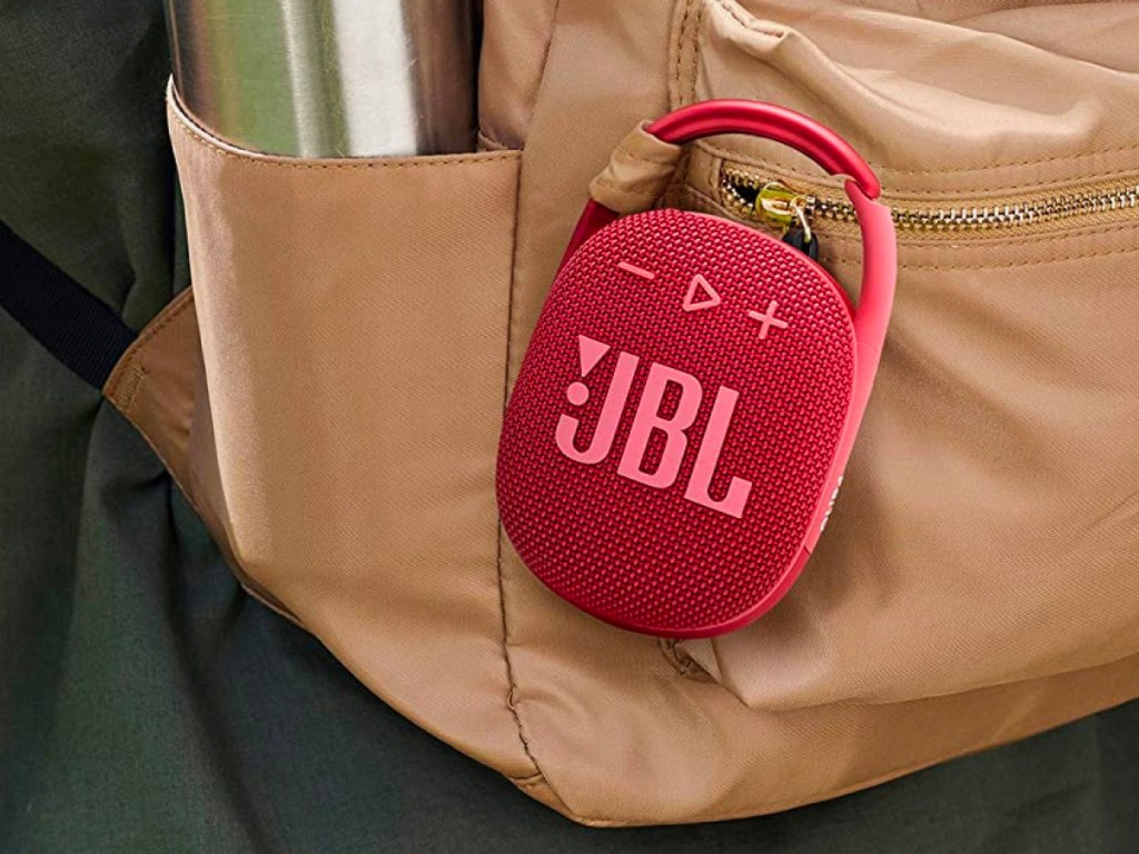 red jbl speaker hooked onto backpack