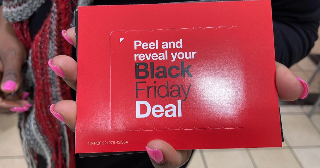 hand holding JCP mystery coupon