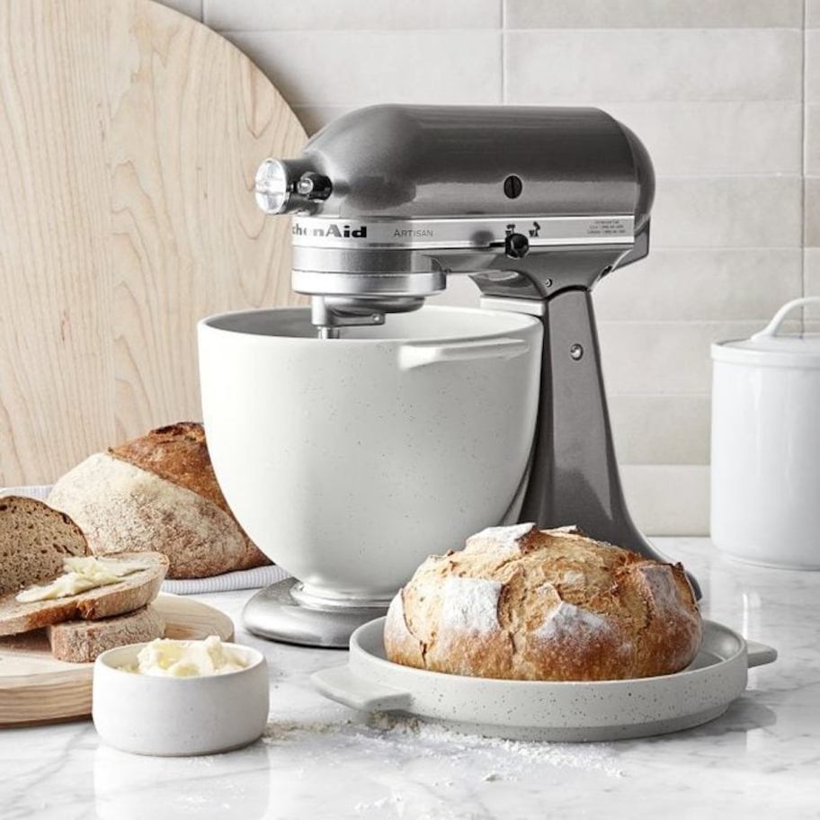 kitchen aid bread bowl and mixer on counter with fresh baked breads