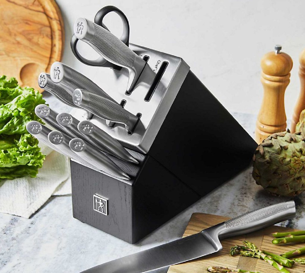 knife block with knives sticking out them and food around