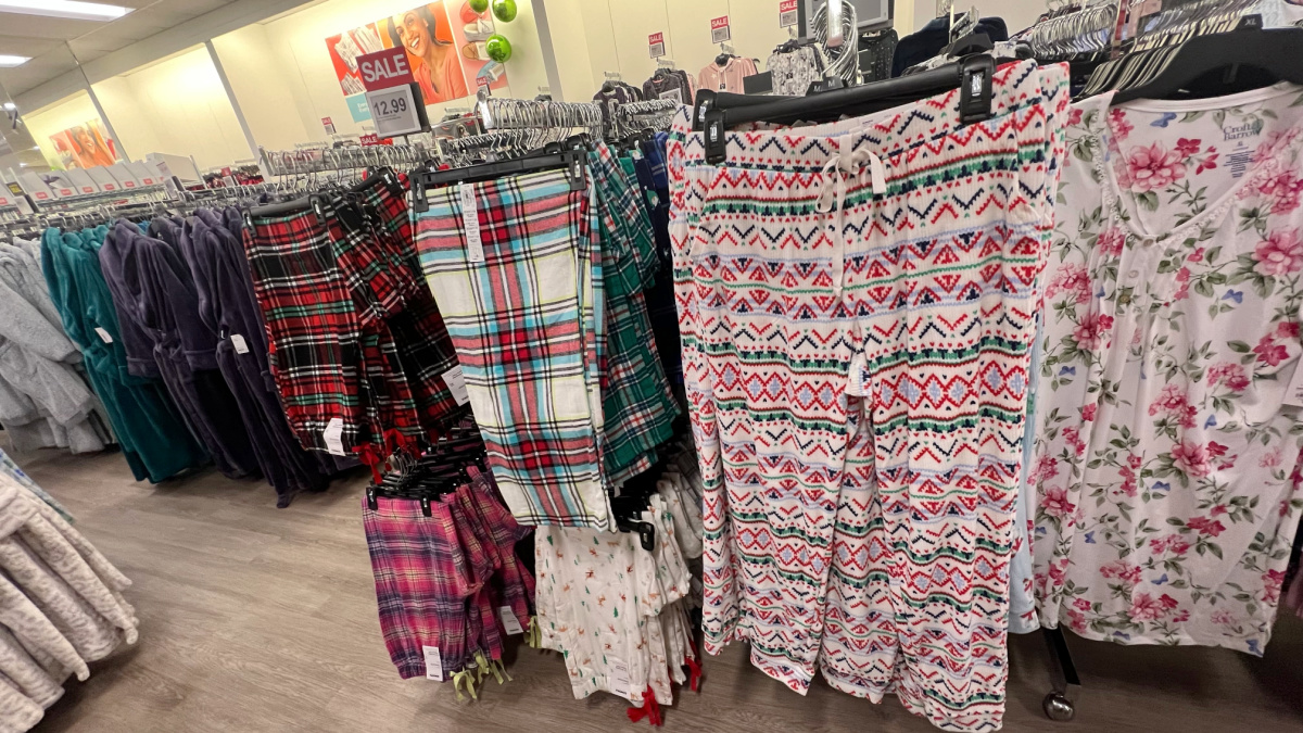 various leggings, joggers, and pants on a display rack in a kohls store