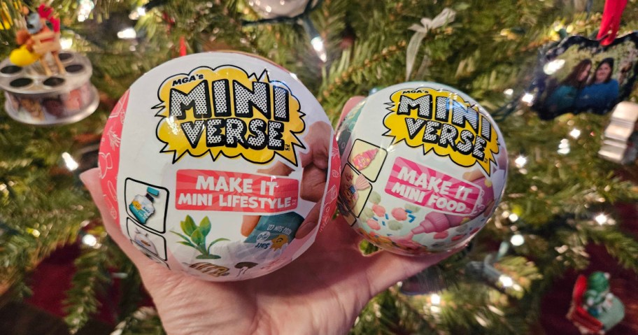 holding two Mini-Verse surprise balls