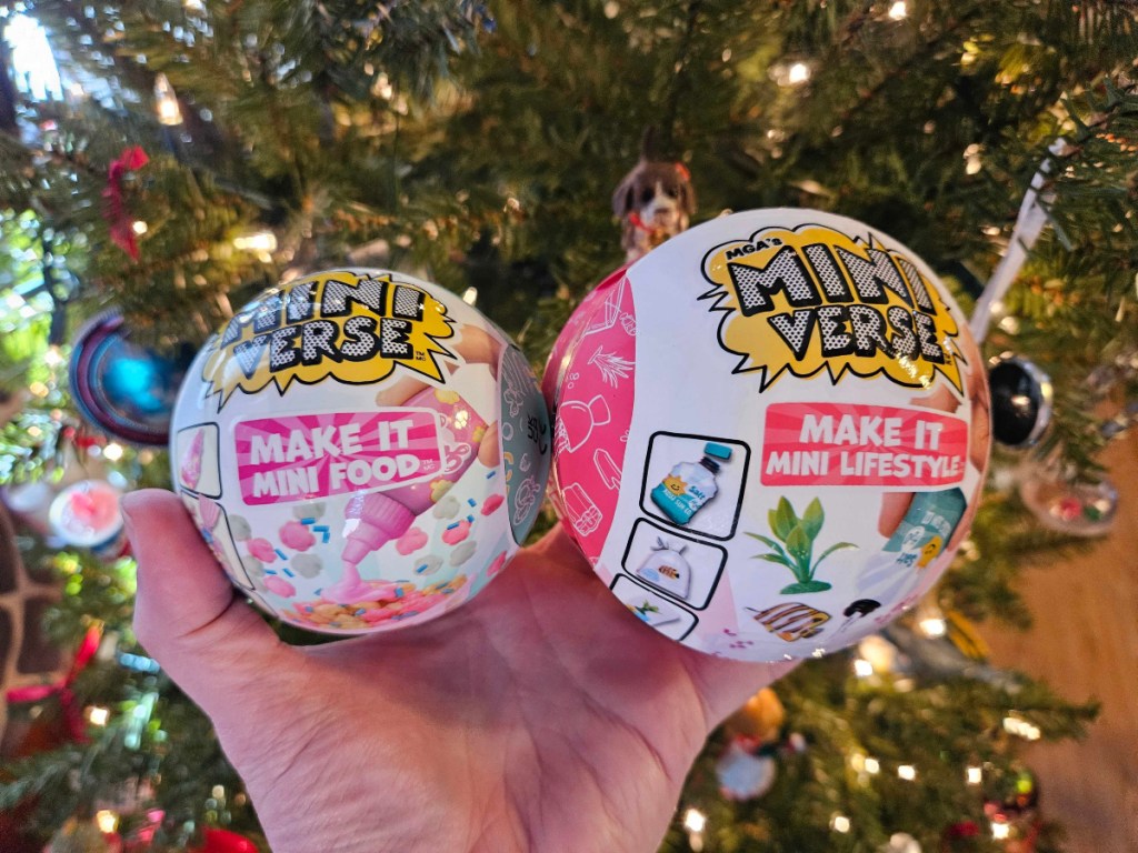 holding 2 Mini Verse surprise balls