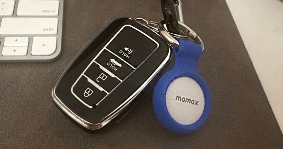 momax tracker on keyring laying on table
