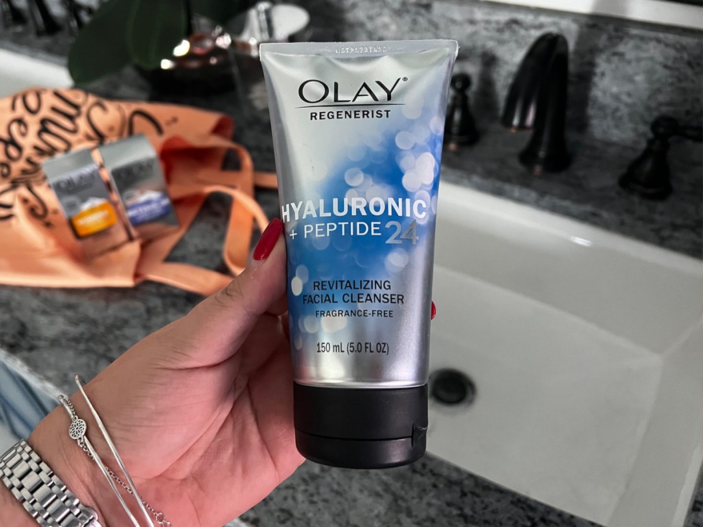 hand holding olay cleanser