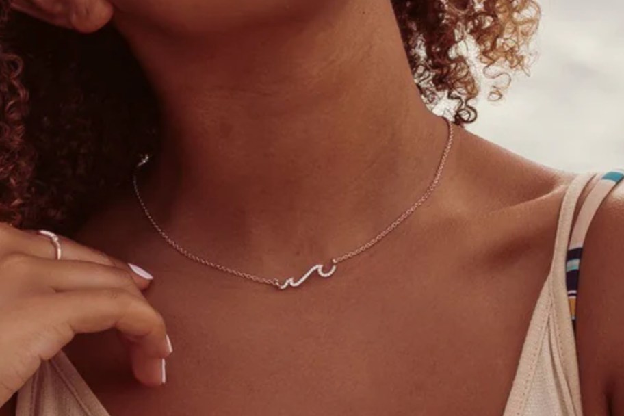 girl wearing rose gold wave necklace