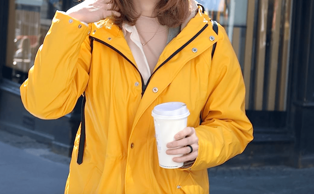 woman wearing yellow rain jacket 