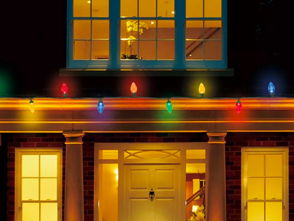 christmas lights hanging on outside of house