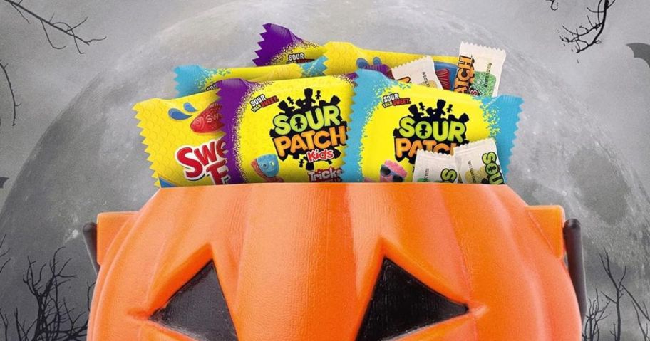 sour patch kids candy in trick-or-treat pumpkin bucket