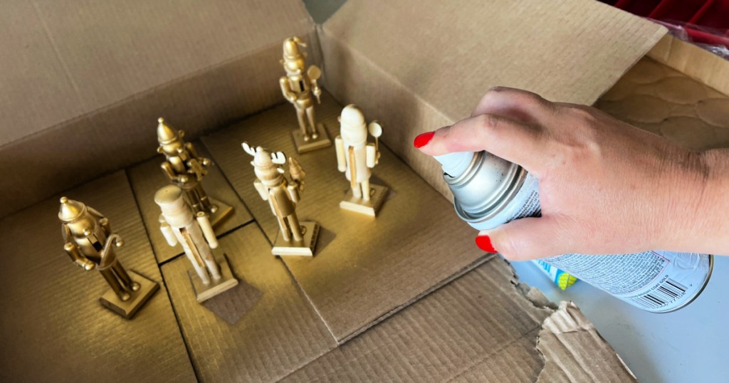 spray painting wooden nutcrackers gold