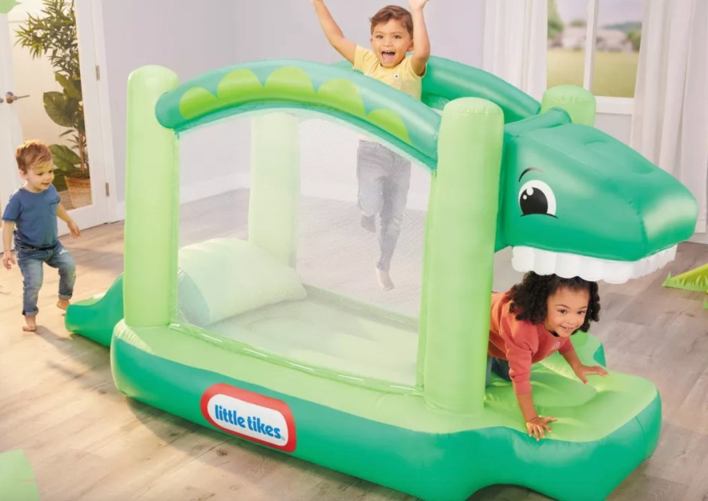 kids playing on little tikes dino bouncer