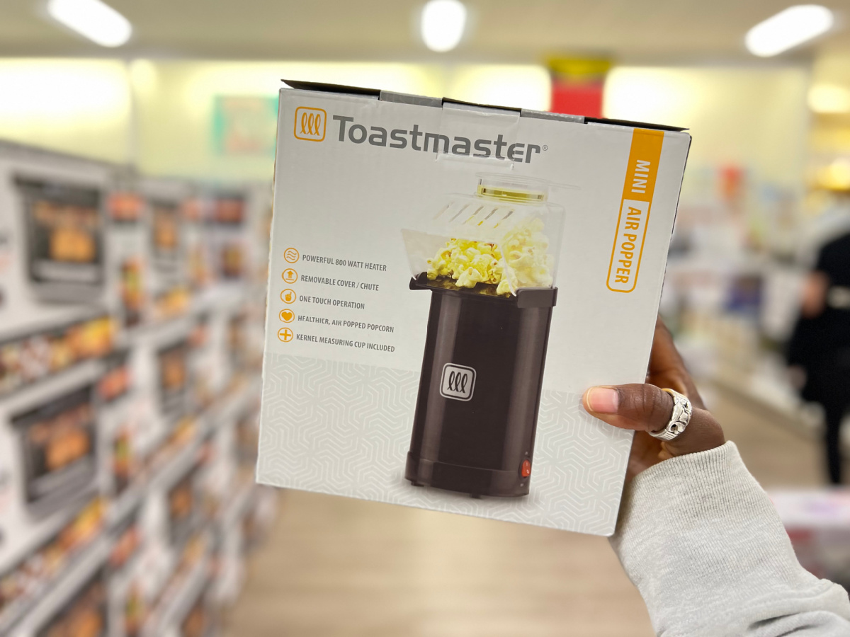 hand holding a toastmaster air popper in the middle of a kohls aisle