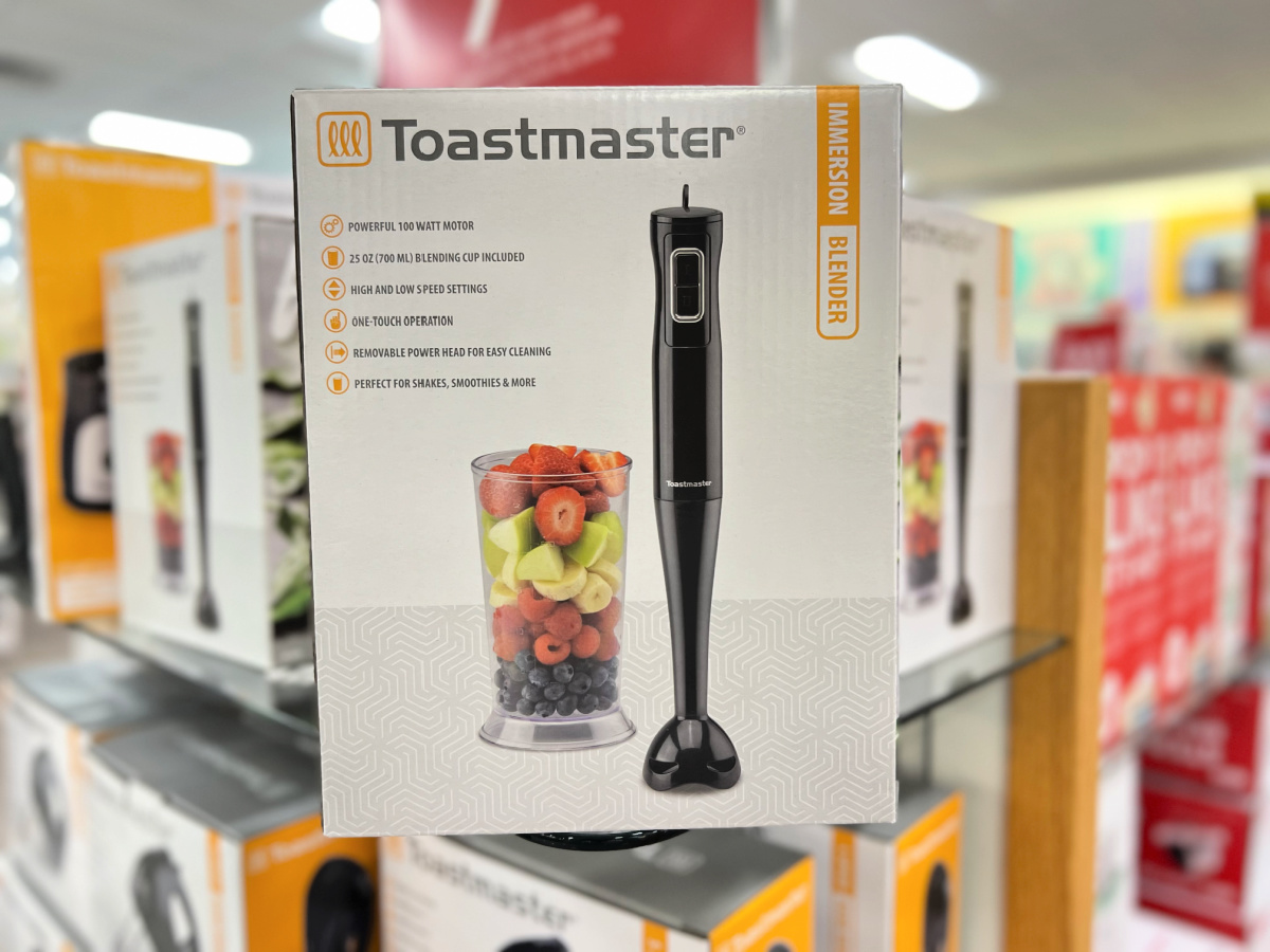 hand holding a toastmaster immersion blender box in the middle of a kohls store