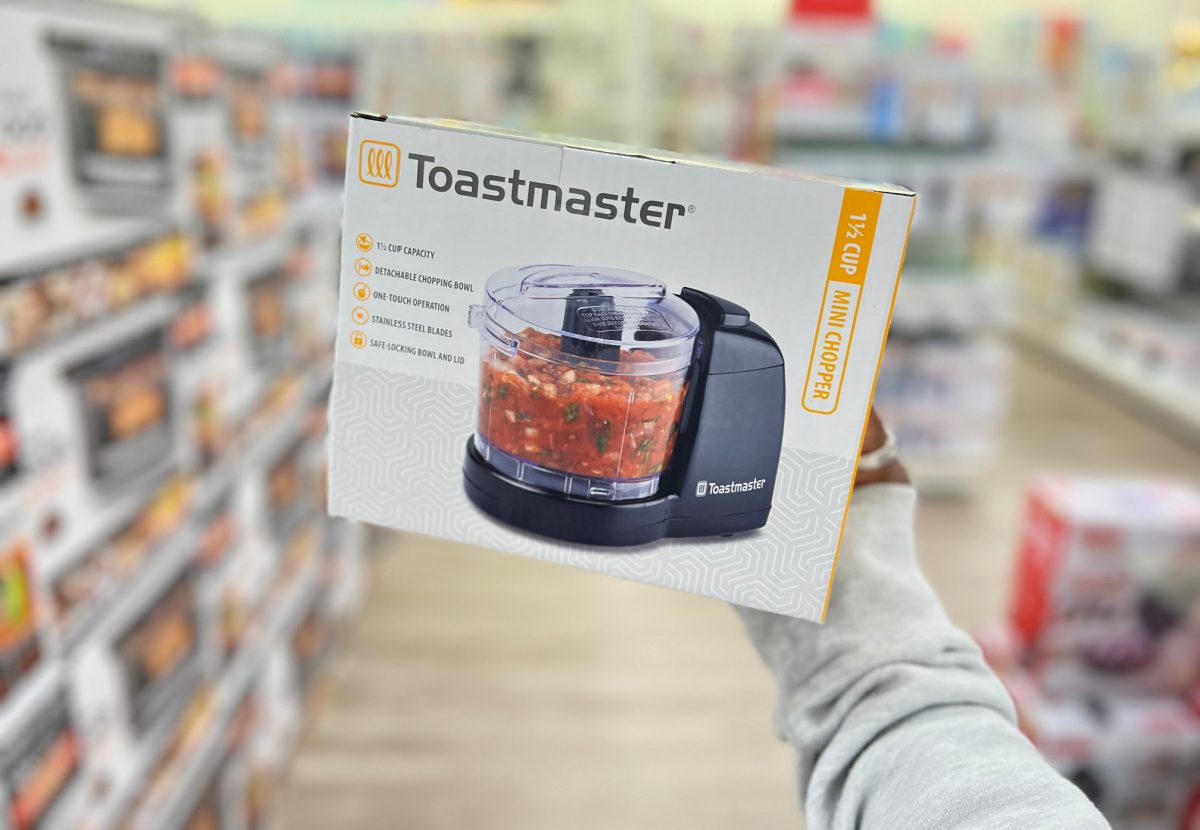hand holding a toastmaster mini chopper box in the middle of a kohls aisle