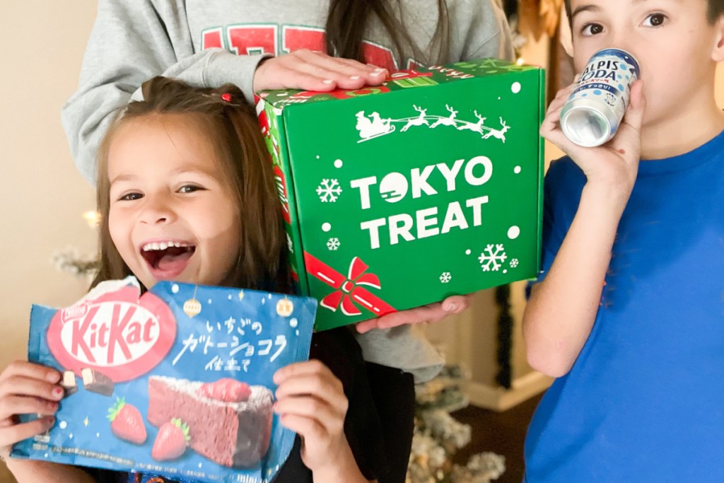 kids eating japanese snacks next to tokyo treat box