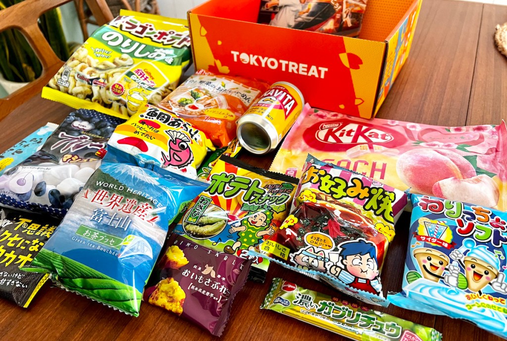 Various foreign snacks, laying on the table with Tokyo treat box 