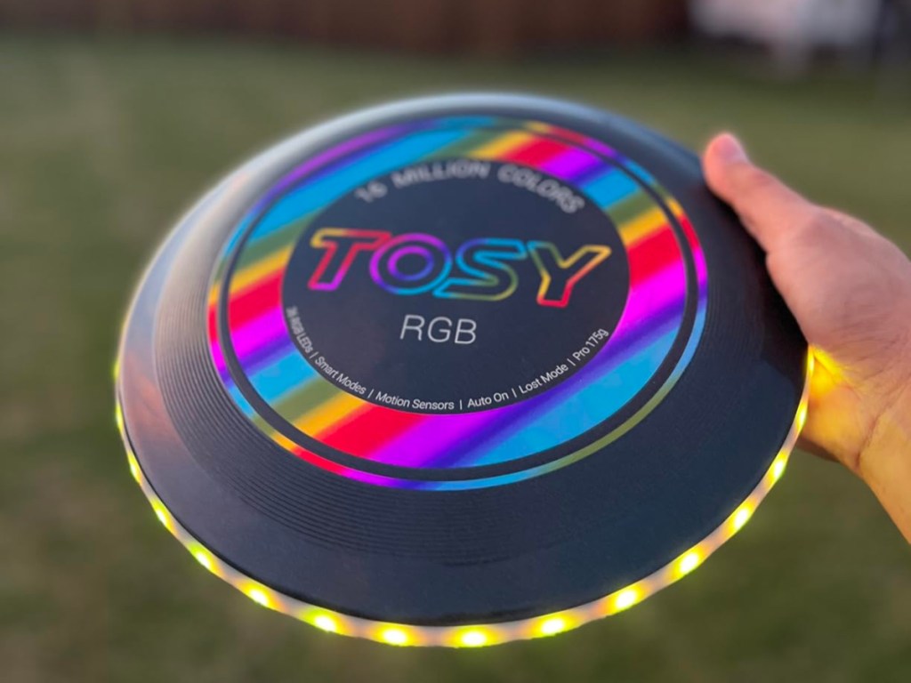 holding a light-up frisbee