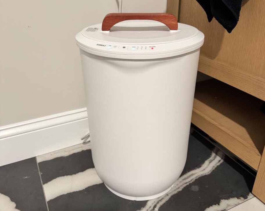 white towel warmer on bathroom floor