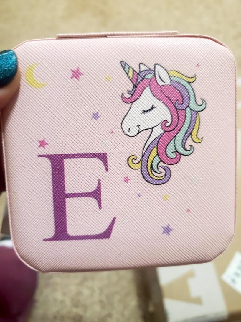 holding unicorn jewelry case 