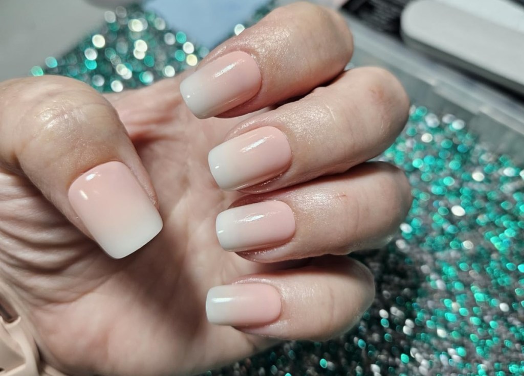 woman showing her hands with press on nails