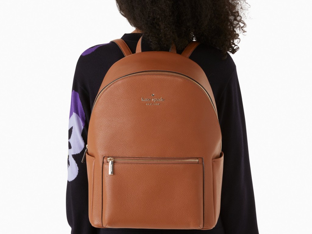 woman wearing Kate Spade Leila Pebbled Leather Large Dome Backpack