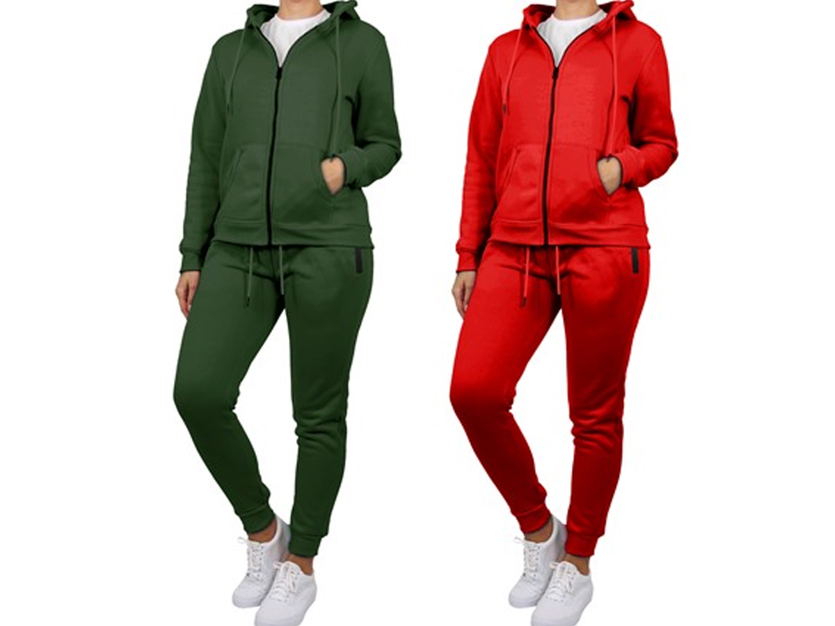 two women wearing green and red hoodie and jogger sets