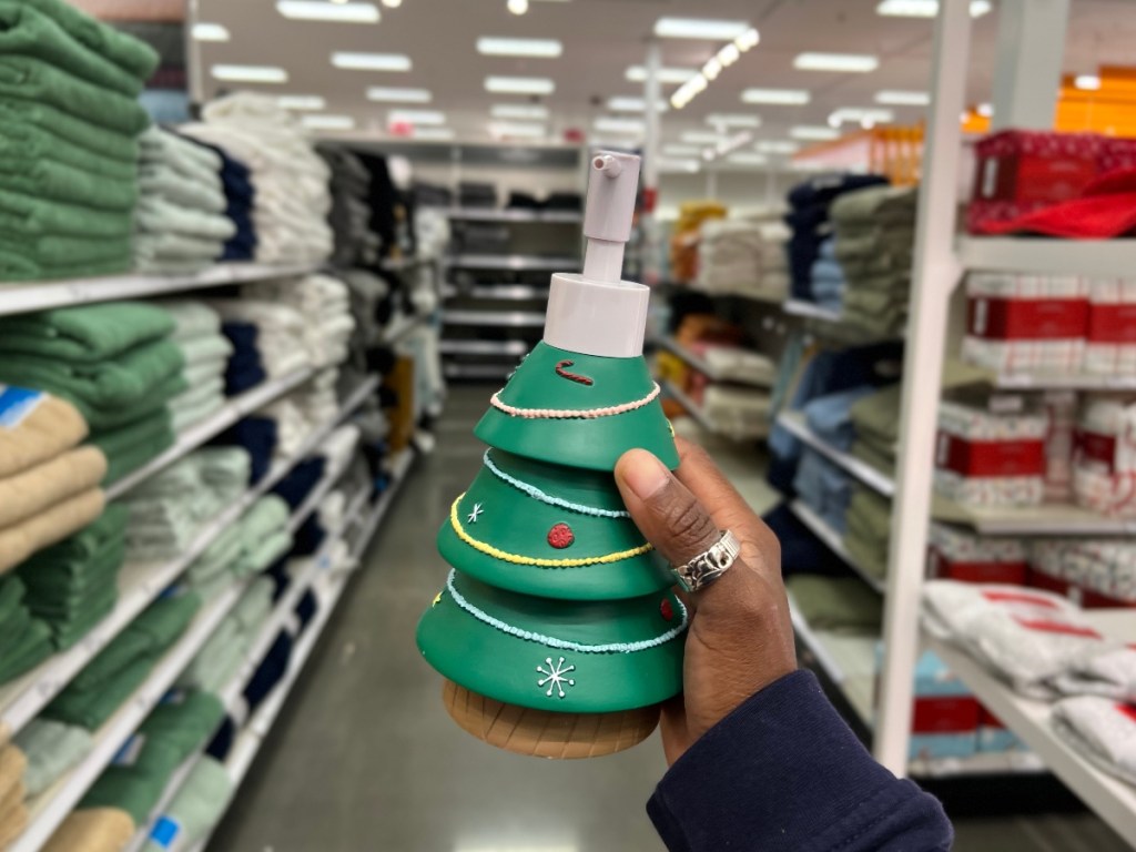 holding a Christmas tree soap pump