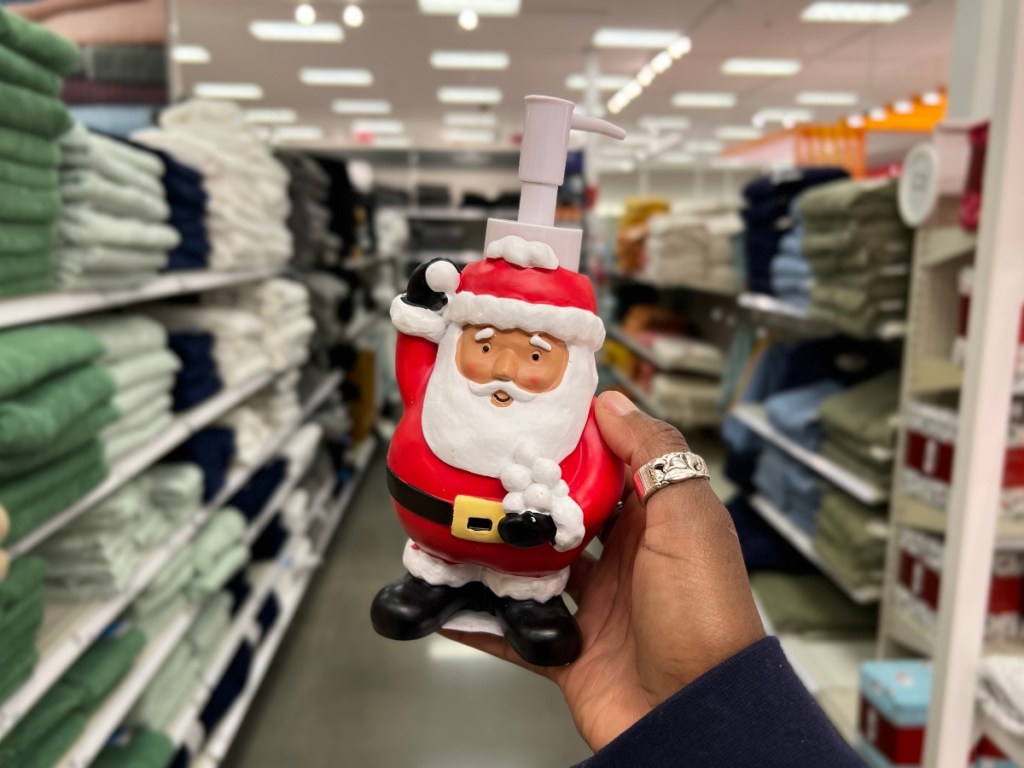 holding a Santa hand soap pump