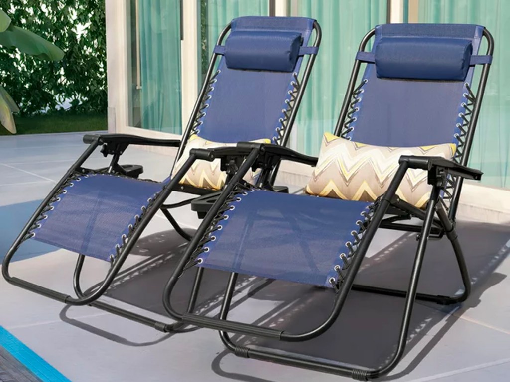 two navy gravity chairs on patio