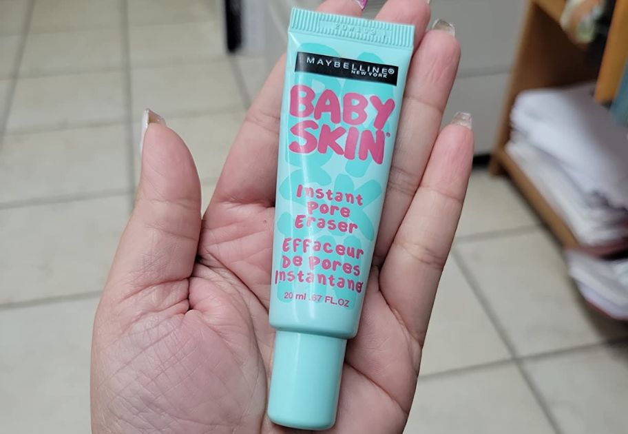 hand holding a tube of Maybelline Baby Skin Instant Pore Eraser Primer