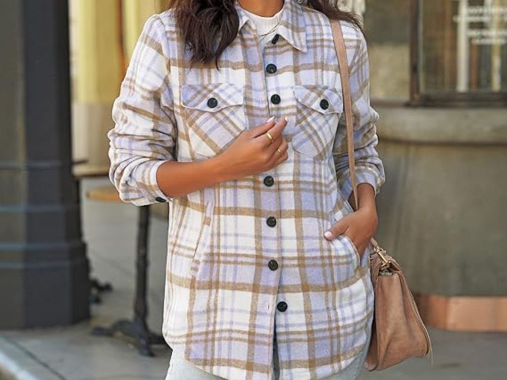 woman wearing a white, grey and gold plaid shacket