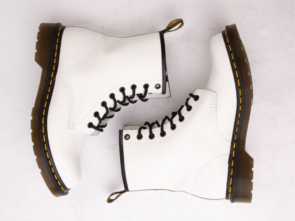 pair of women's white lace up Dr. Marten's boots