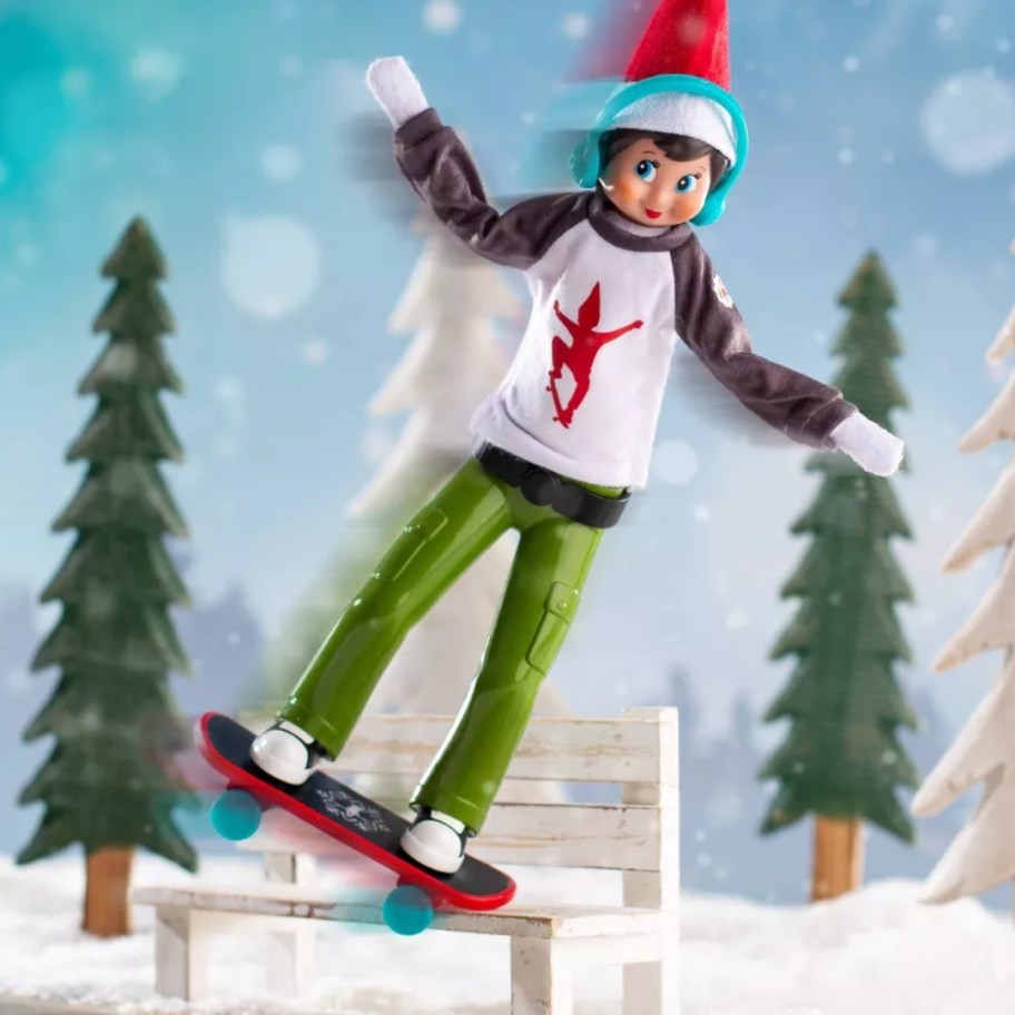 Elf on The Shelf doll in a skateboarding outfit with headphones and a skateboard