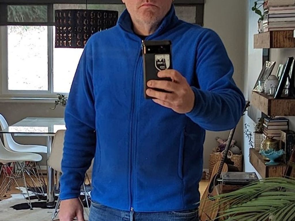 Man wearing a cobalt blue amazon essentials fleece