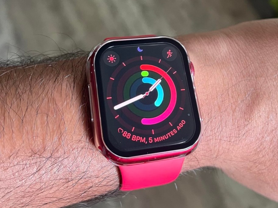 apple watch series 8 in red on person's wrist