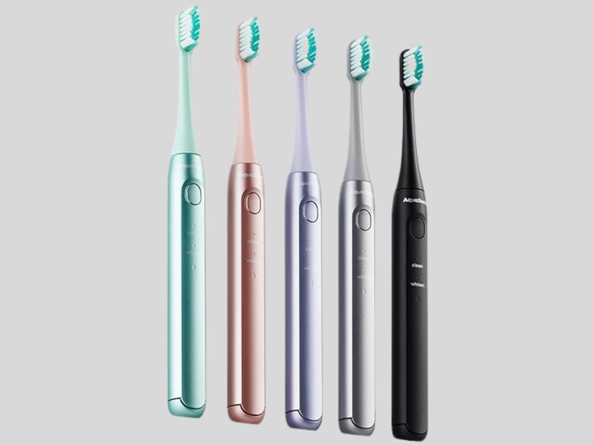 green, pink, purple, silver and black electric toothbrushes