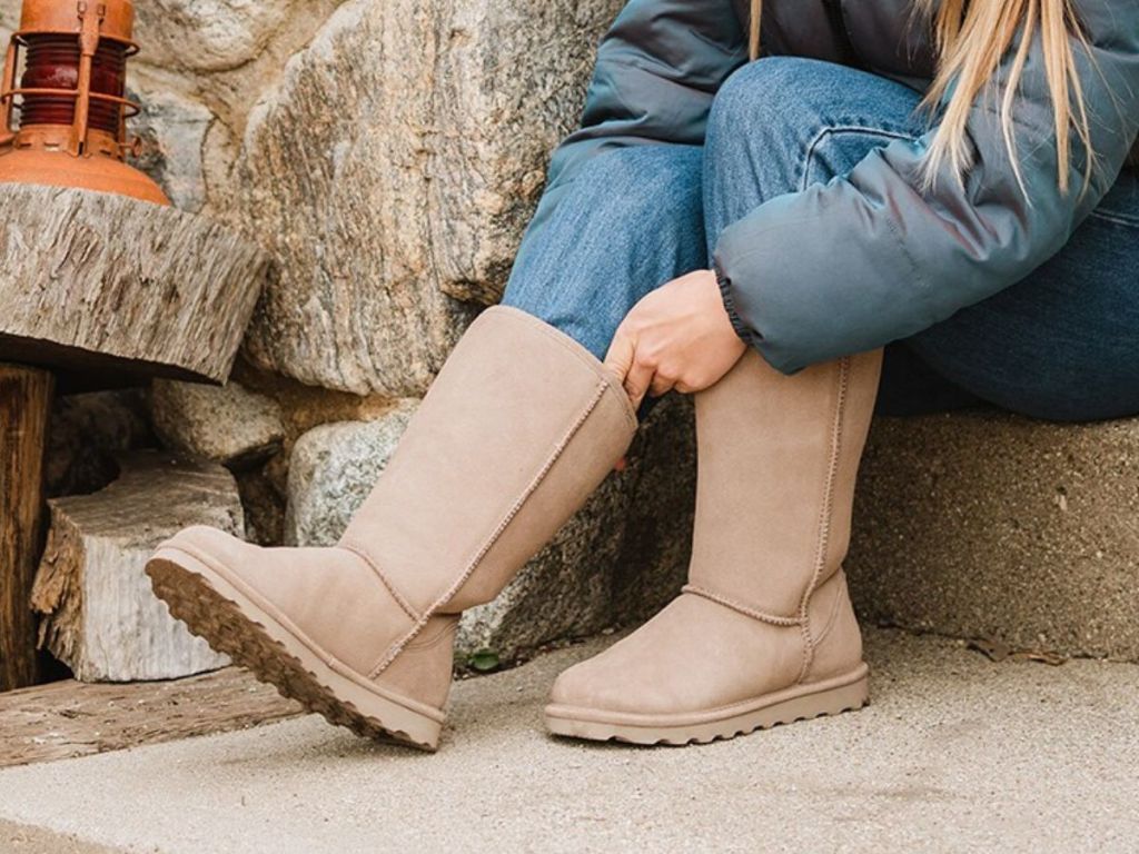 A woman wearing a pair of Bearpaw Elle Tall Boot in Mushroom